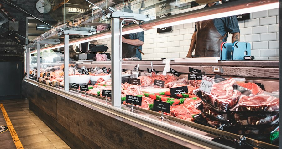 A butcher’s counter with fresh cuts on display