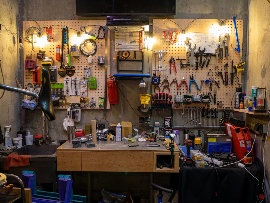 A tidy repair workshop with tools on the wall